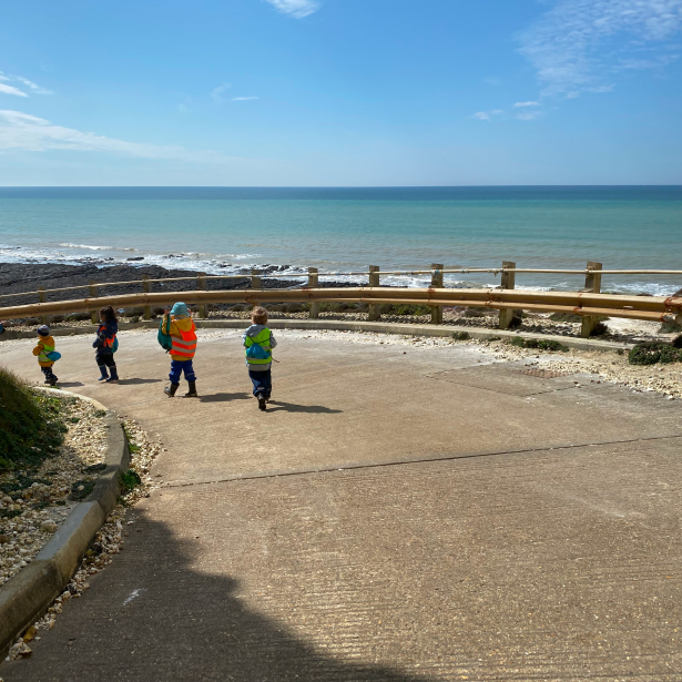 children walking to the seaside